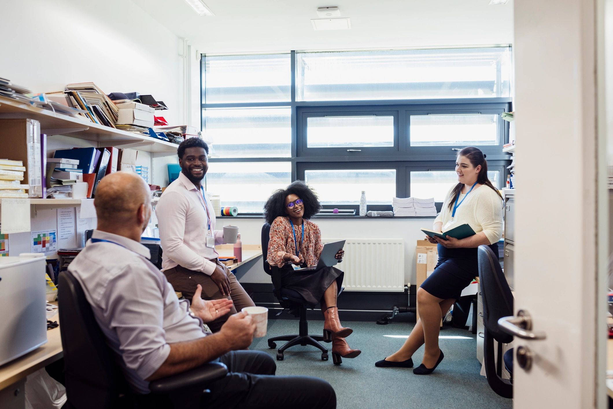 Professional team discussing work together in an office